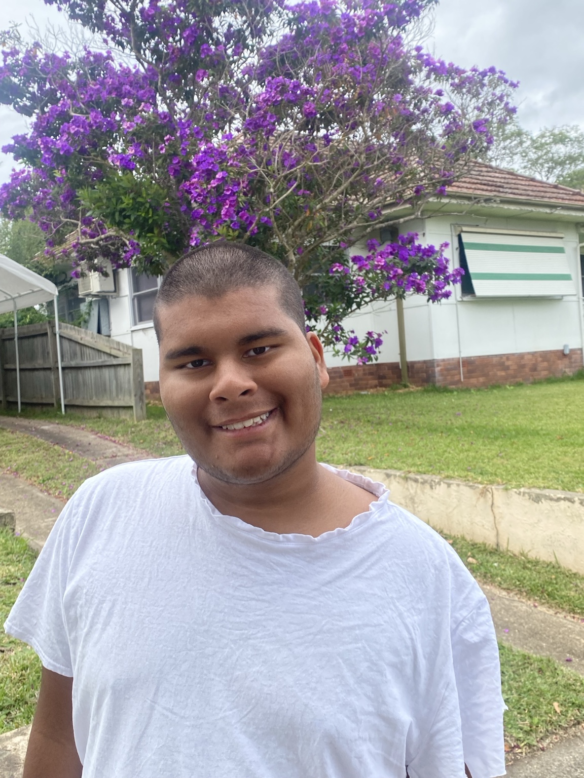 Adam smiling outdoors